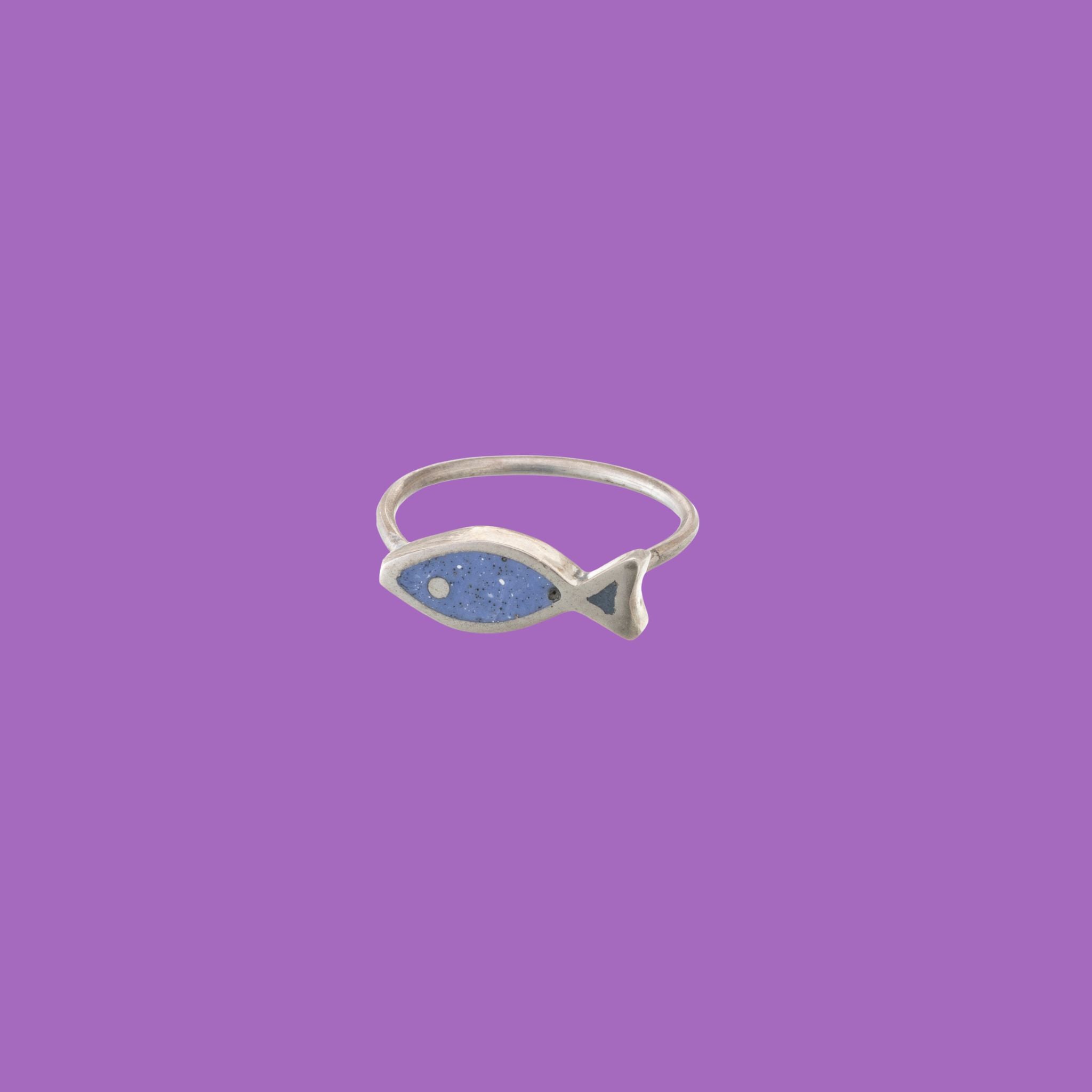 Handcrafted brass rings, shaped like graceful sugar paper flounder fish