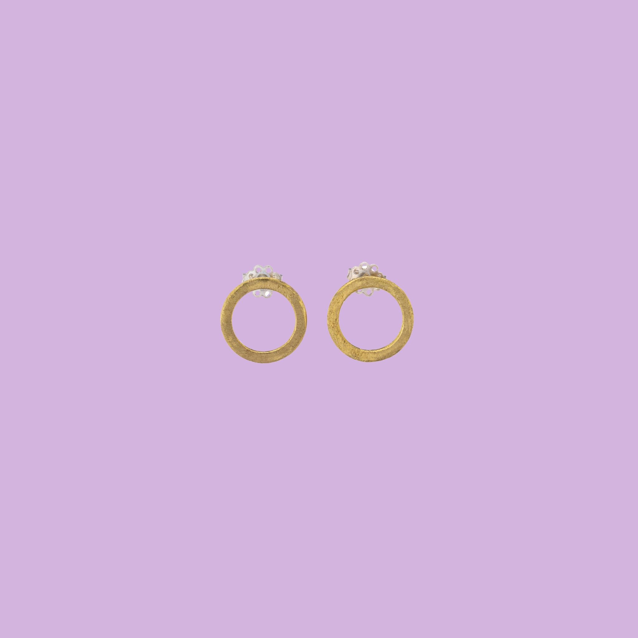 Adorn yourself with KiaraLN's Small brass Ring-shaped Earrings, a perfect blend of elegance and style. Handcrafted with meticulous attention to detail, these brass earrings exude timeless charm and artistic flair.