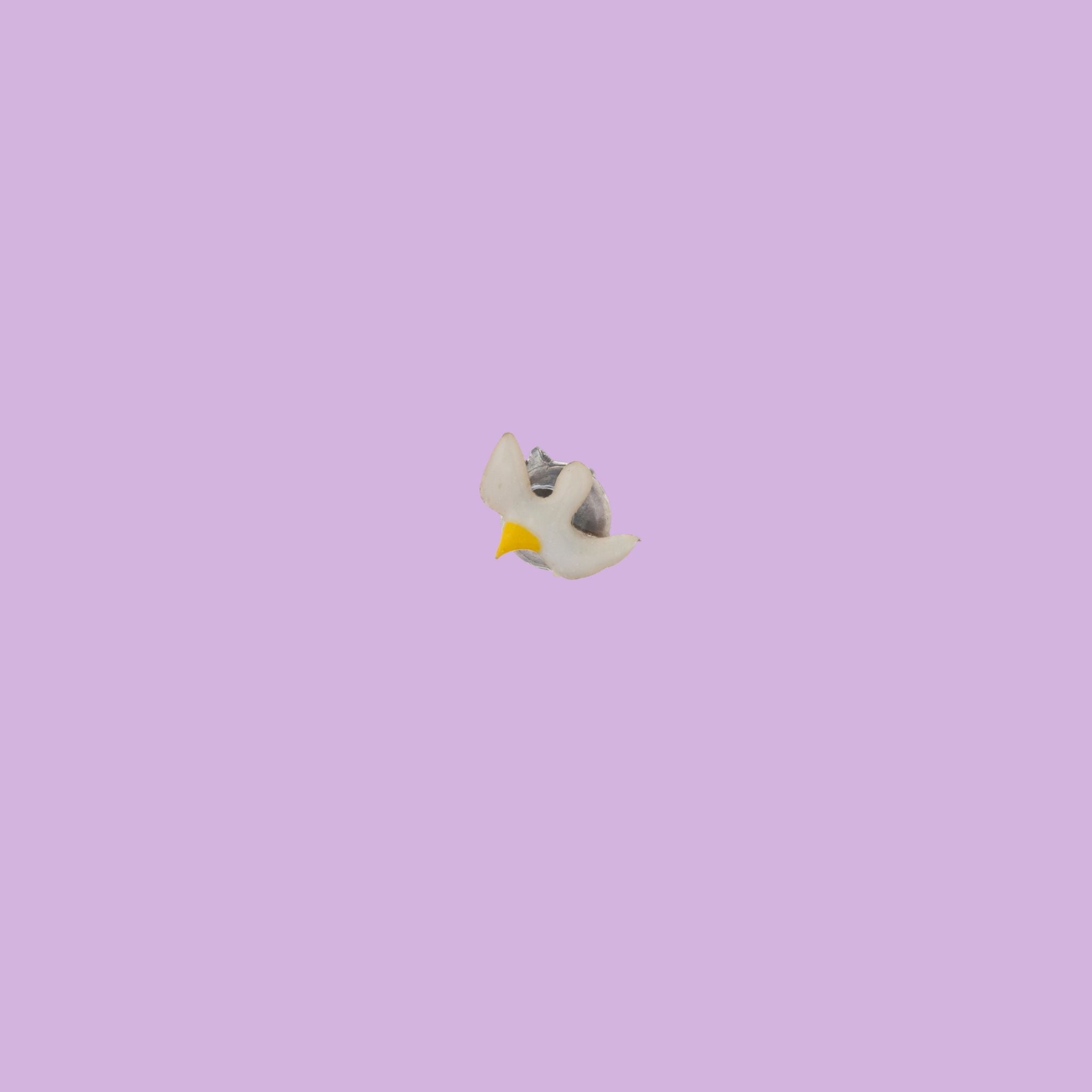 Handmade by Fabian Crosta, this single brass earring features a seagull design