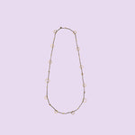 Handmade by KiaraLN, the "Ring" brass necklace with coral accents adds a touch of natural elegance to any outfit.
