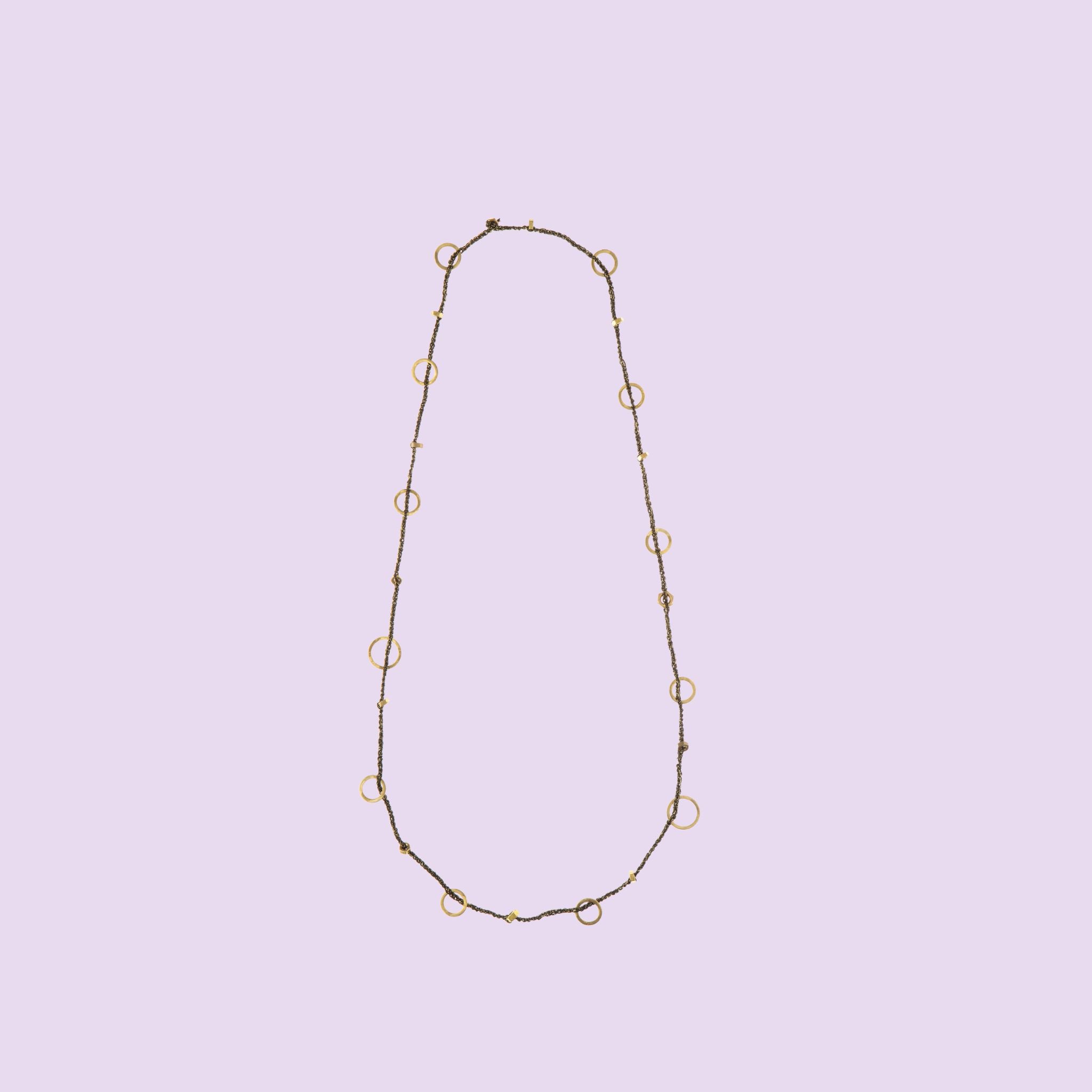 Handmade by KiaraLN, the "Ring" brass necklace with coral accents adds a touch of natural elegance to any outfit.