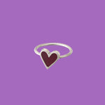 Brass ring featuring a purple heart-shaped accent