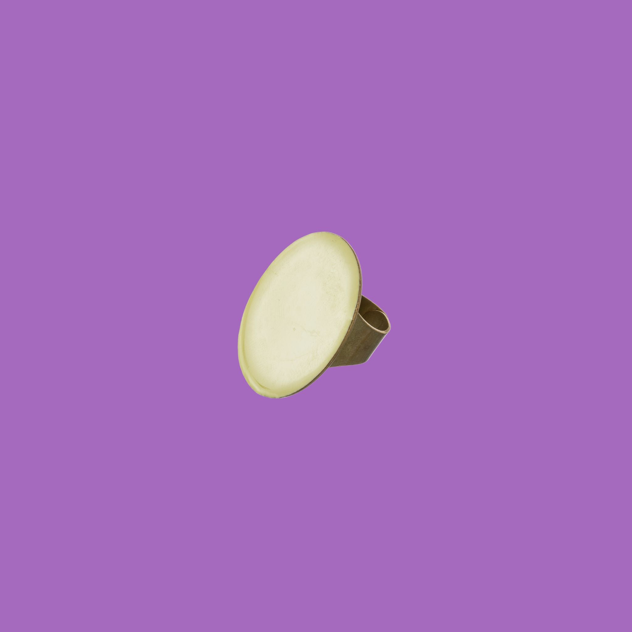beautifully handcrafted brass ring featuring an oval-shaped design in green