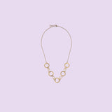 Handmade by KiaraLN, this wide brass necklace offers a chic and timeless style. 