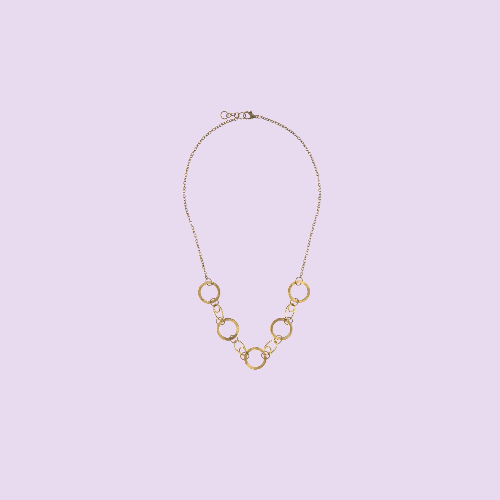 Handmade by KiaraLN, this wide brass necklace offers a chic and timeless style. 